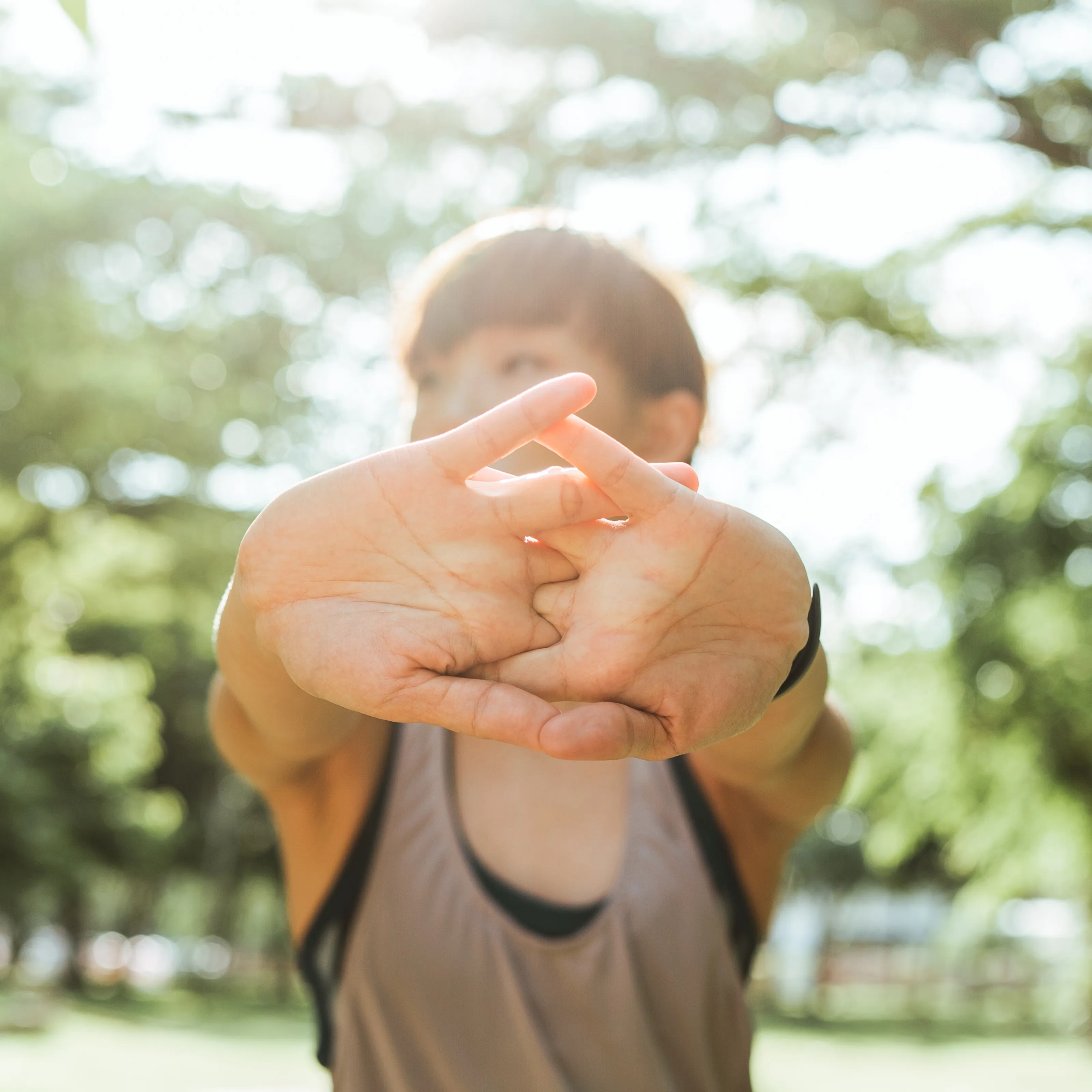 A woman using her hands to stretch